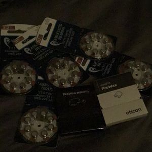 New in package hearings aid batteries 5 packs and  minifit pro wax 2 pack